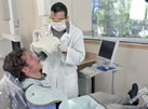 Student taking patient X-ray
